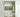 Neatly organized kitchen cabinet with various food items in jars and containers on shelves