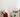 Closet rod tightly packed with hanging clothes in a variety of colors and styles