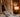 Table lamp casting warm light in a cozy living room