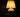 Compact lamp on a small bedside table
