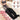 Full-leg air compression massager boots with labeled features for thighs, calves, knees, and ankles